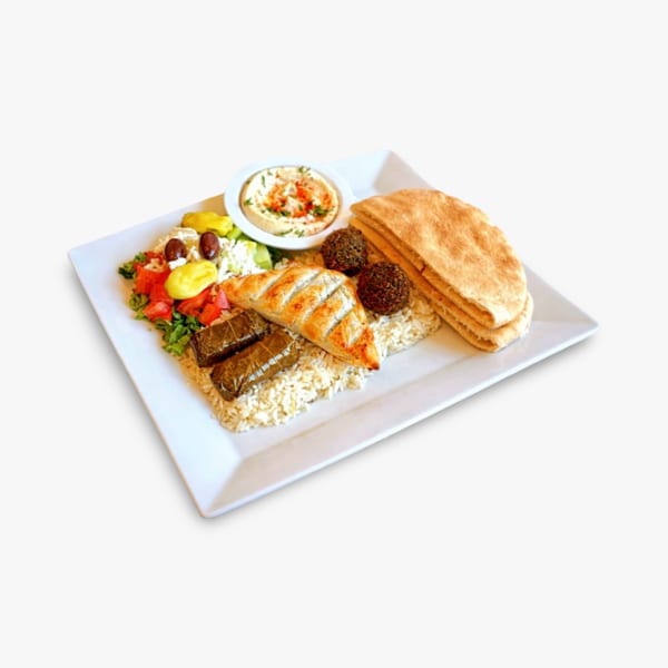 Mediterranean platter with grilled chicken, dolmas, falafel, rice, salad, hummus, and pita bread.