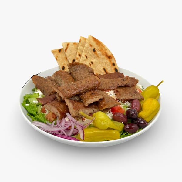California Pita & Grill's gyro plate with meat, pita bread, salad, feta, olives, and peppers.
